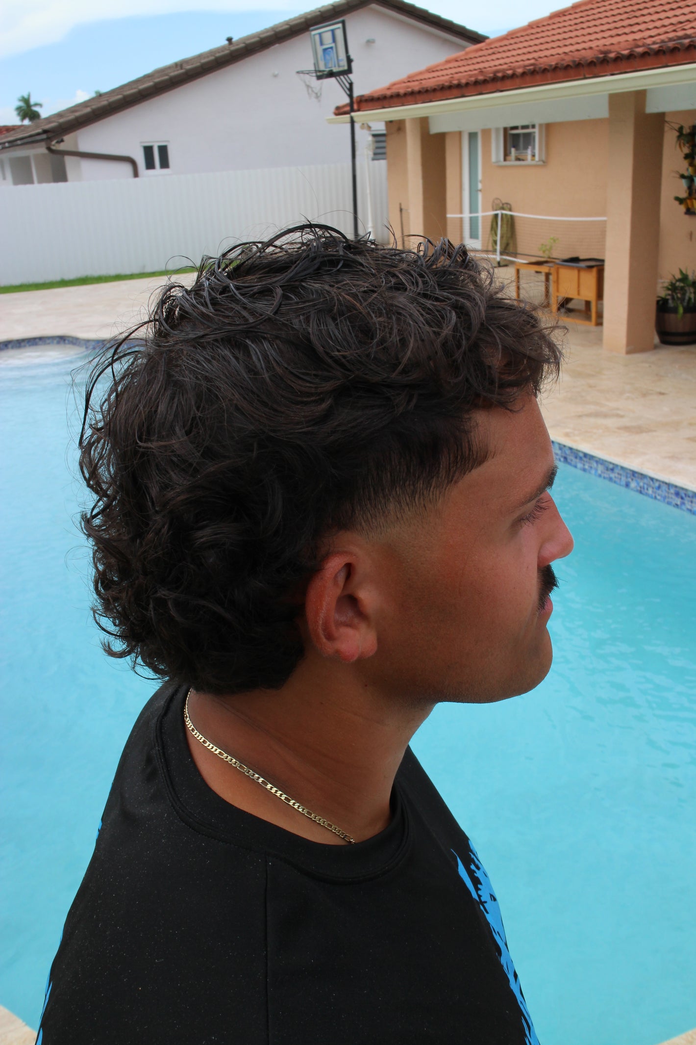 Side profile of a man after applying sea salt spray, showcasing textured, voluminous sea salt spray hair. This image demonstrates what does sea salt spray do for effortless style and natural hold, highlighting why it's the best sea salt spray for achieving a desired look. Ideal for sea salt spray men, this sea salt hair spray proves effective for both straight and sea salt spray and curly hair, serving as a good sea salt spray that provides results without damage. It's the top choice for those seeking the 